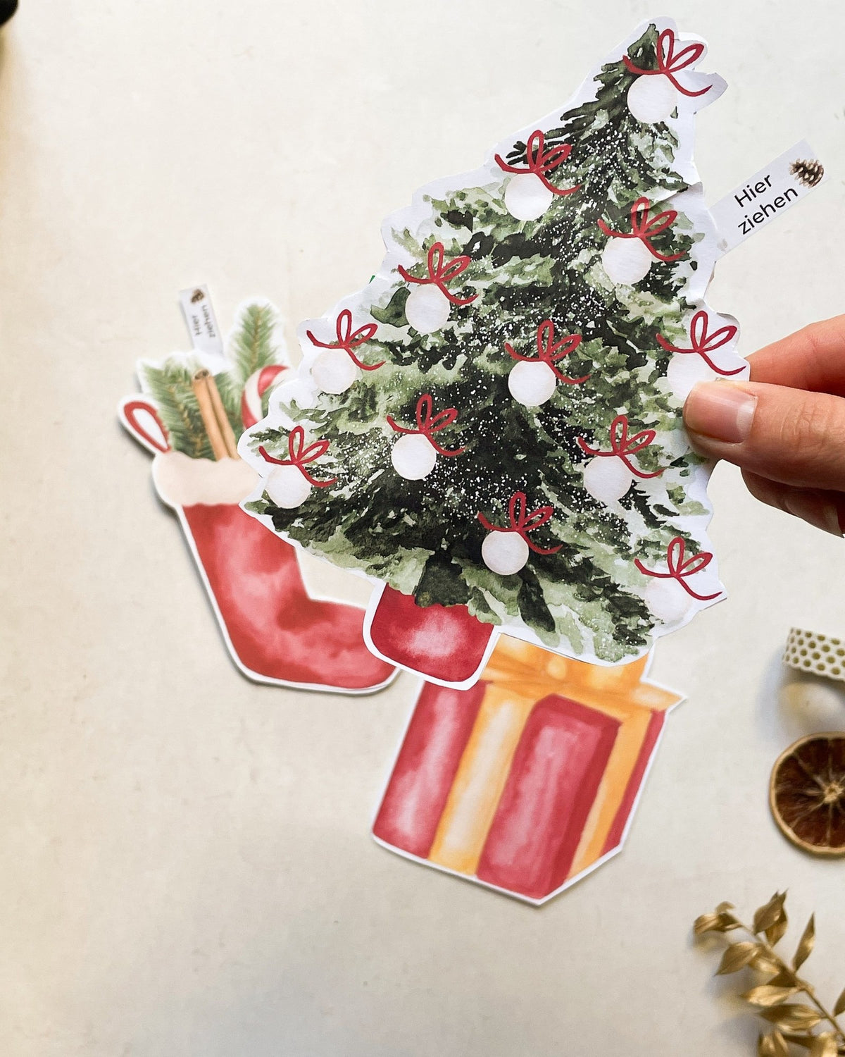 Geldgeschenk zum Aufreißen in drei Weihnachtsmotiven